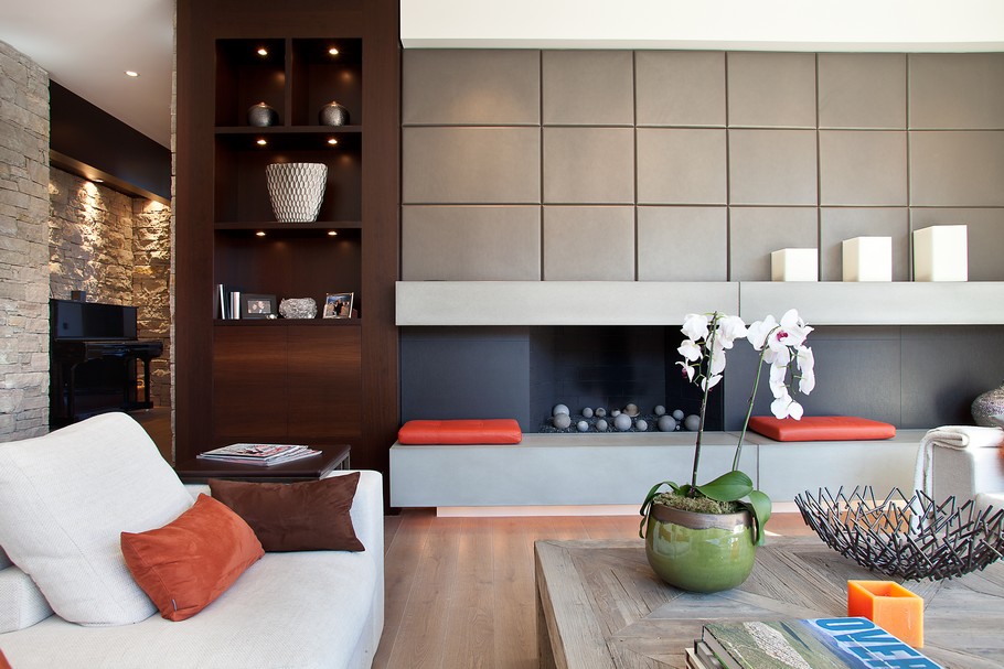 Long White Sofa and Modern Fireplace near Wooden Table