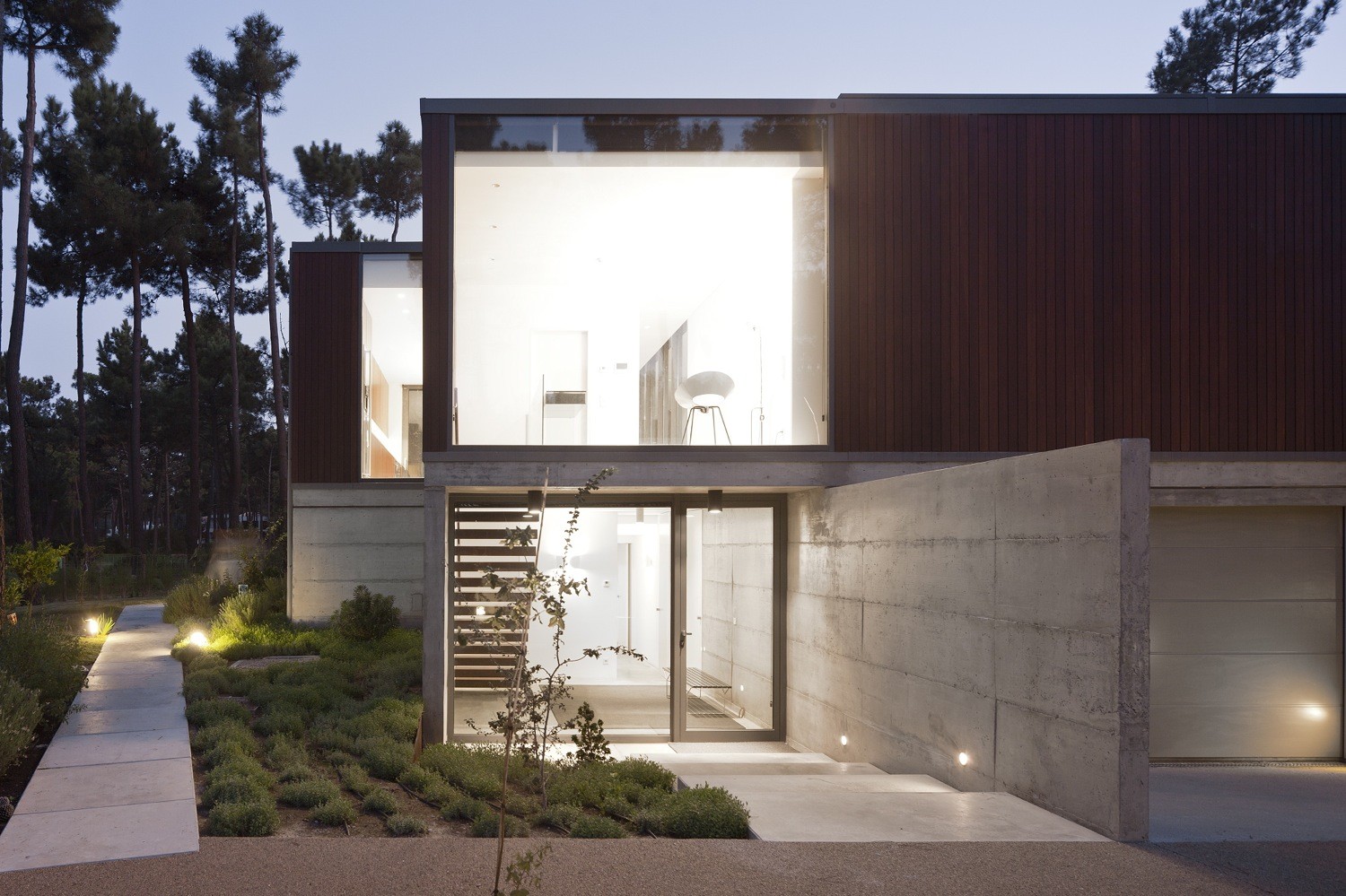 Evening View At Aroeira III House Show Modern Parisian Garden Woth Concrete Pathway Also Glass Entry Door