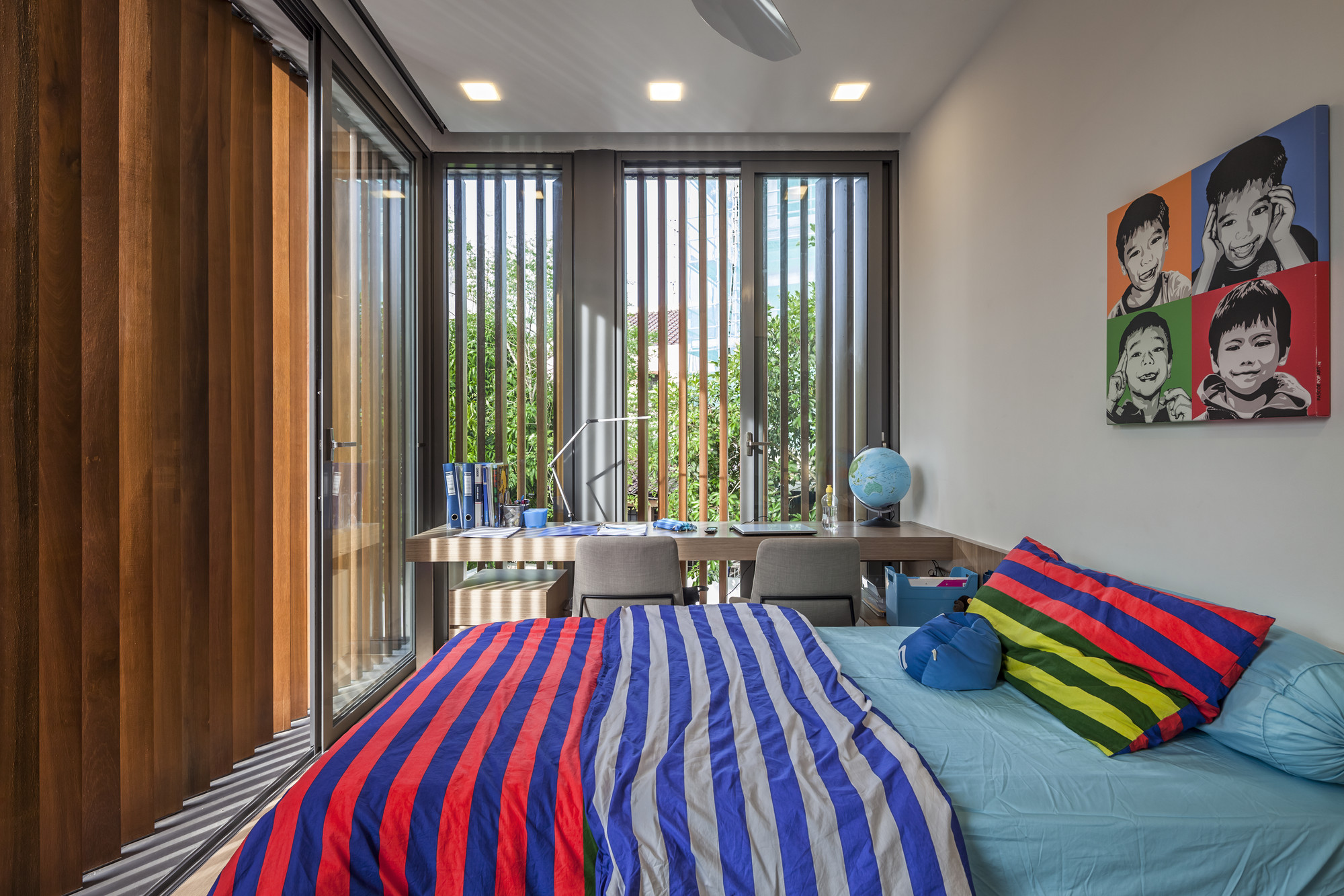 Blue Mint Colored Bed Linen Along With Several Colors Of Blanket Stripes