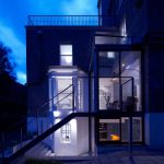 Bright Lightings Over Wide Glass Bay Windows On Frontside Wall Decoration