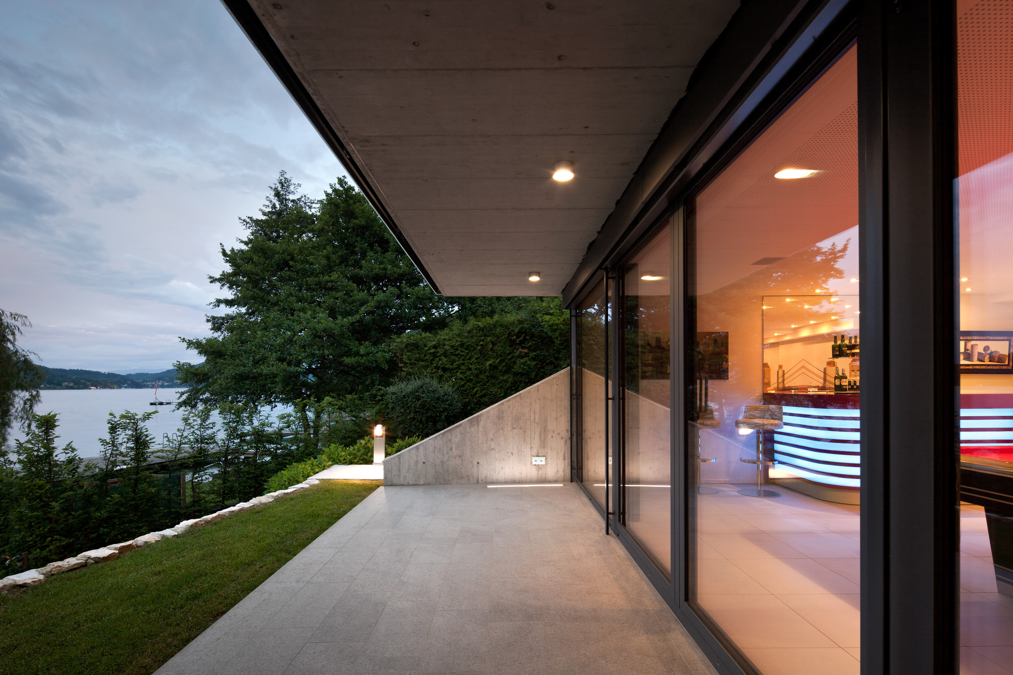 Granite Floor Connected To Green Lawn On Courtyard