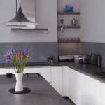 Grey Countertop Of Kitchen Table Added Near A Clock On Wall Decor