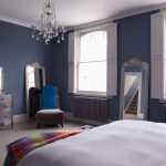 Mirror On Wooden Dresser Added Near Glass Windows On Wall Decoration