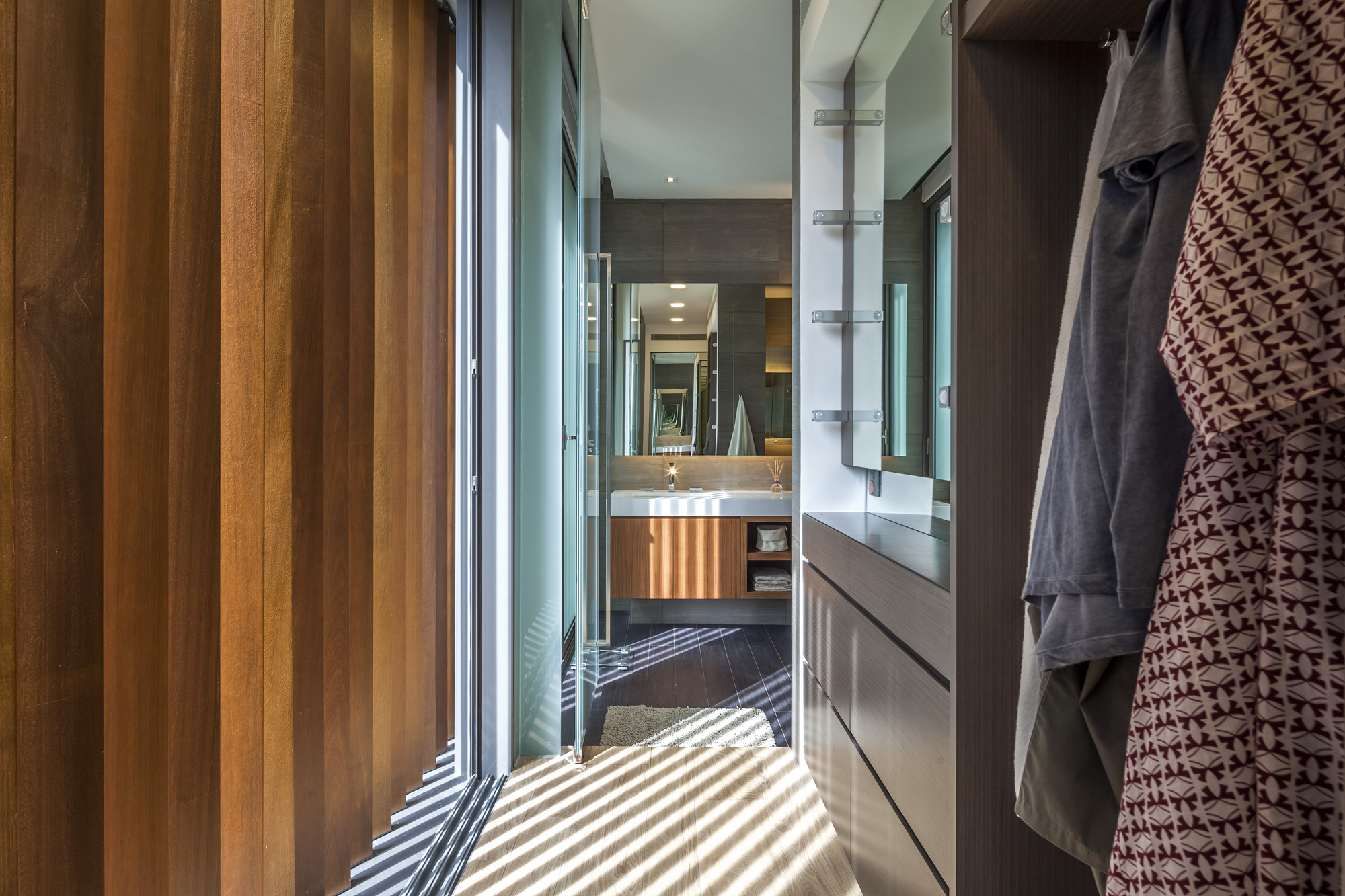 Soft Brown Colored Wooden Floor Along With Dark Brown Wooden Vanity