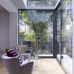 Twin Purple Lounger Added Near Colorful Couches Also Glass Table On Floor