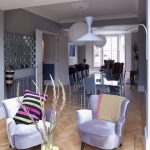 Twin Purple Lounger Added Near Vase Of Flower On Glass Table On Floor