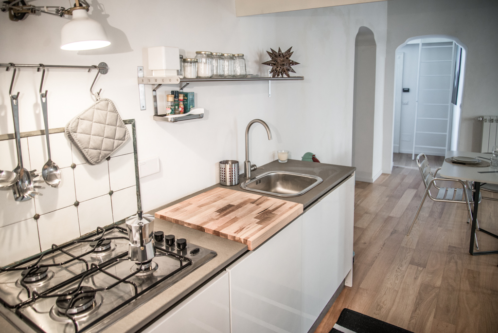 Via delle Orfane by CON3STUDIO - Sink Along With Metallic Water Faucet On Glossy Clear Dresser On Floor