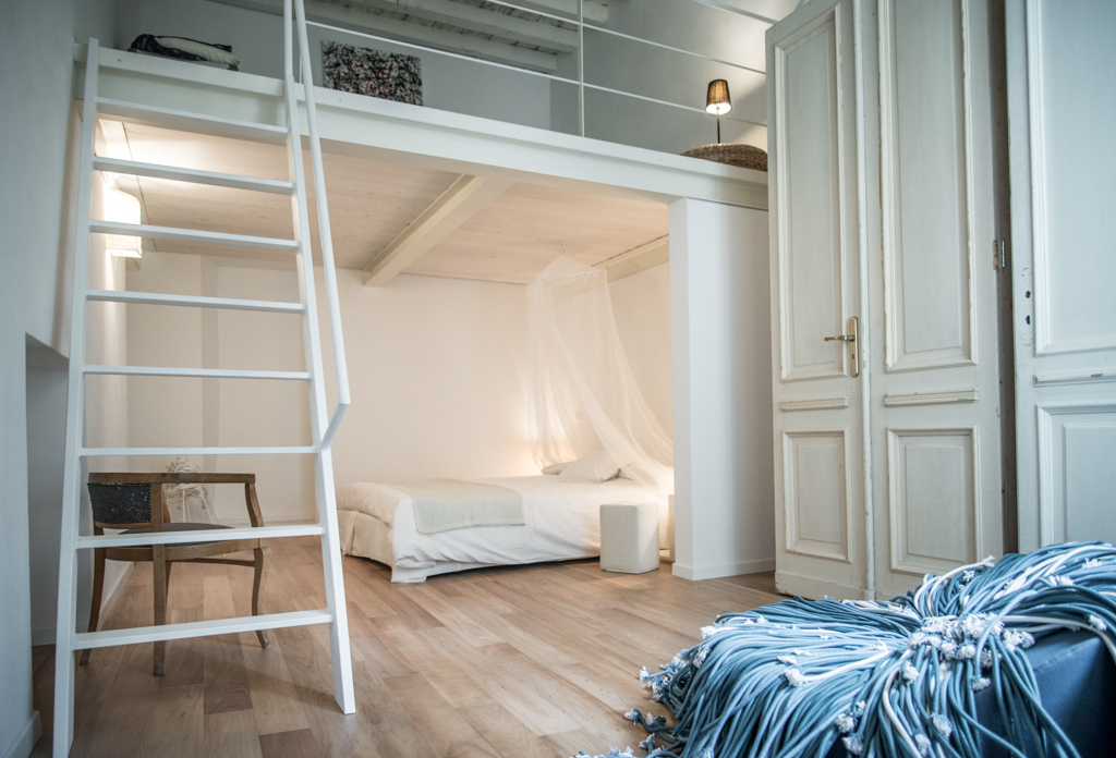 Via delle Orfane by CON3STUDIO - White Bed Added Near A Stair Land On Wooden Floor Also Satnd Wardrobe