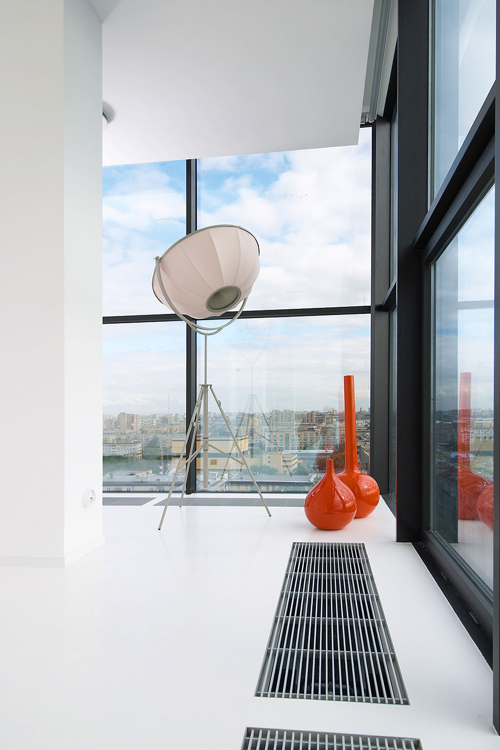 Unique Floor Lamp Along With Red Vases At Corner Of Living Room Nearby Window At Falcons Nest Penthouse Offers Stunning City View Unique Floor Lamp Along With Red Vases At Corner Of Living Room Nearby Window At Falcons Nest Penthouse Offers Stunning City View